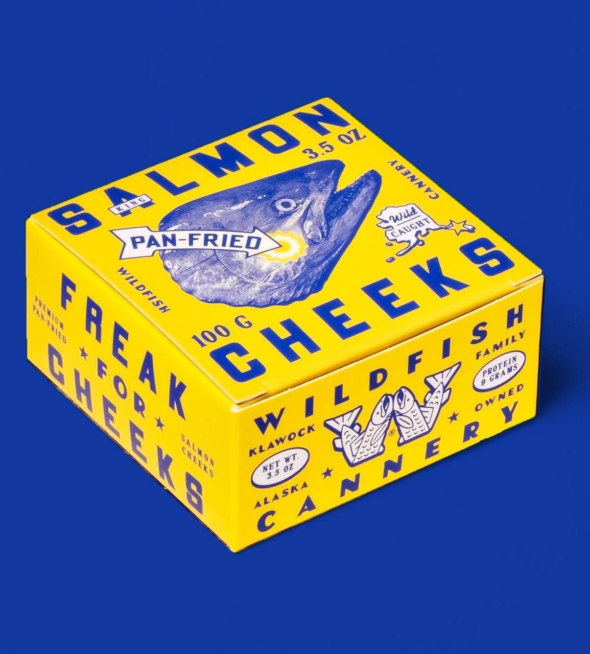Жёлтая коробка с рыбой и надписью Freak for Salmon Cheeks
